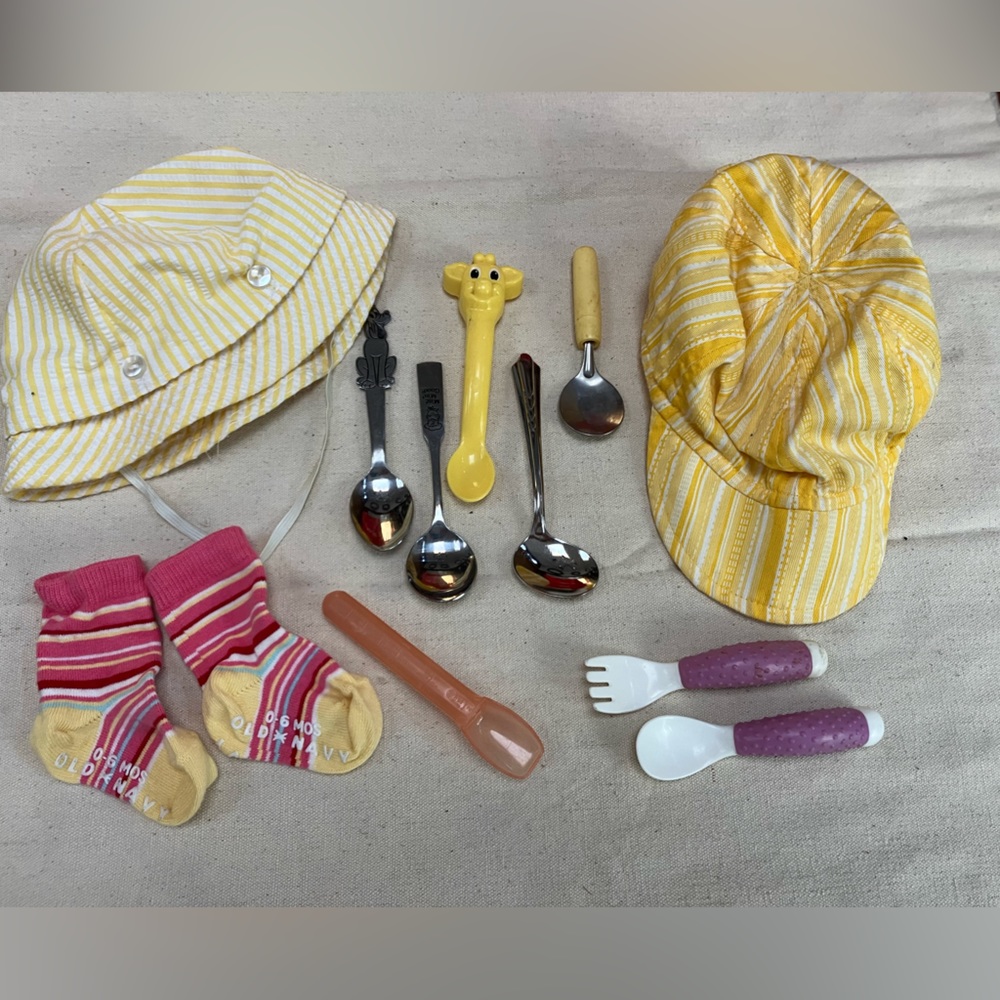 Baby Bundle: 2hats, socks, feeding and self feeding utensils. Liquid meds object